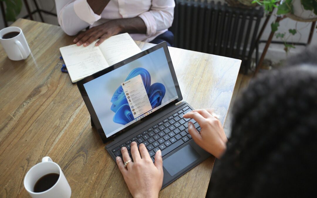 Business meeting with AI-powered Windows 11 Copilot on a laptop