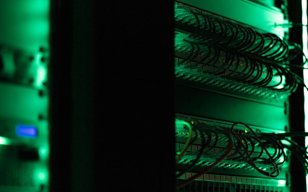 A server room equipment rack, representing proactive managed IT monitoring versus reactive break/fix support